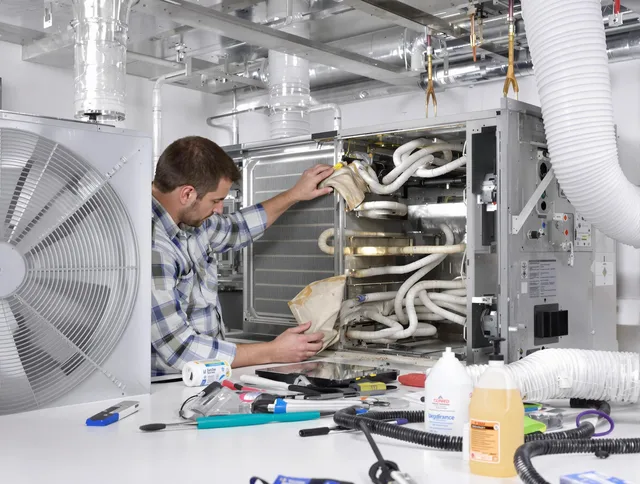 Norton Air Duct Cleaning specialist performing precision AC coil cleaning in Norton