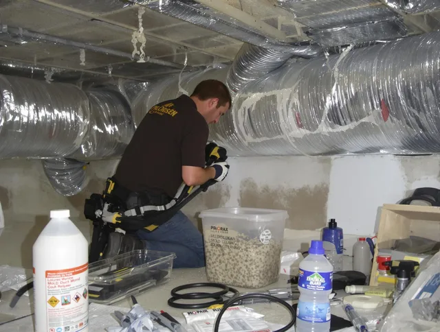Norton Air Duct Cleaning specialist performing professional mold removal from air ducts in Norton