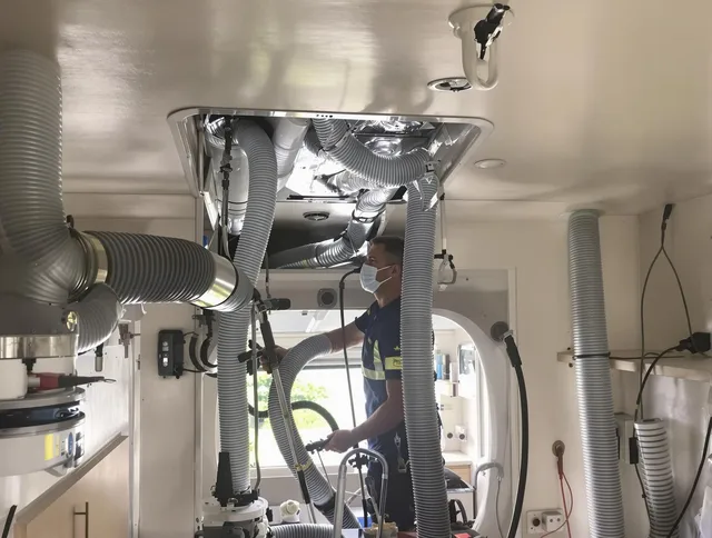 Norton Air Duct Cleaning specialist performing precise mobile home duct cleaning in Norton