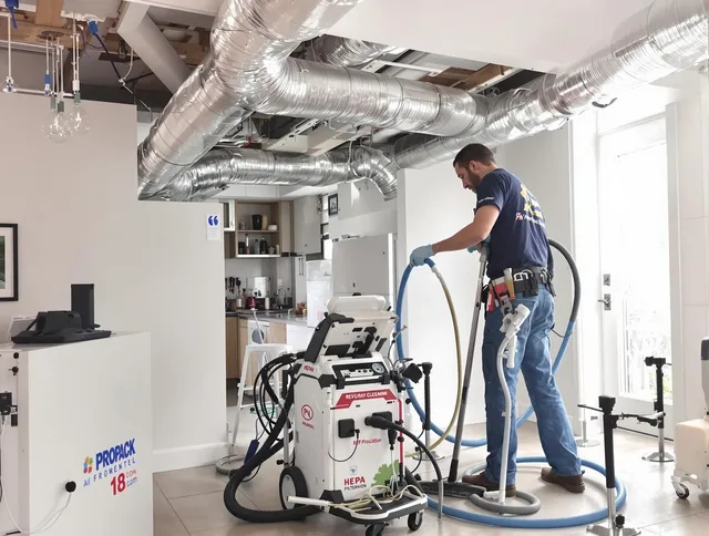Norton Air Duct Cleaning technician performing advanced pure duct cleaning with specialized equipment in Norton